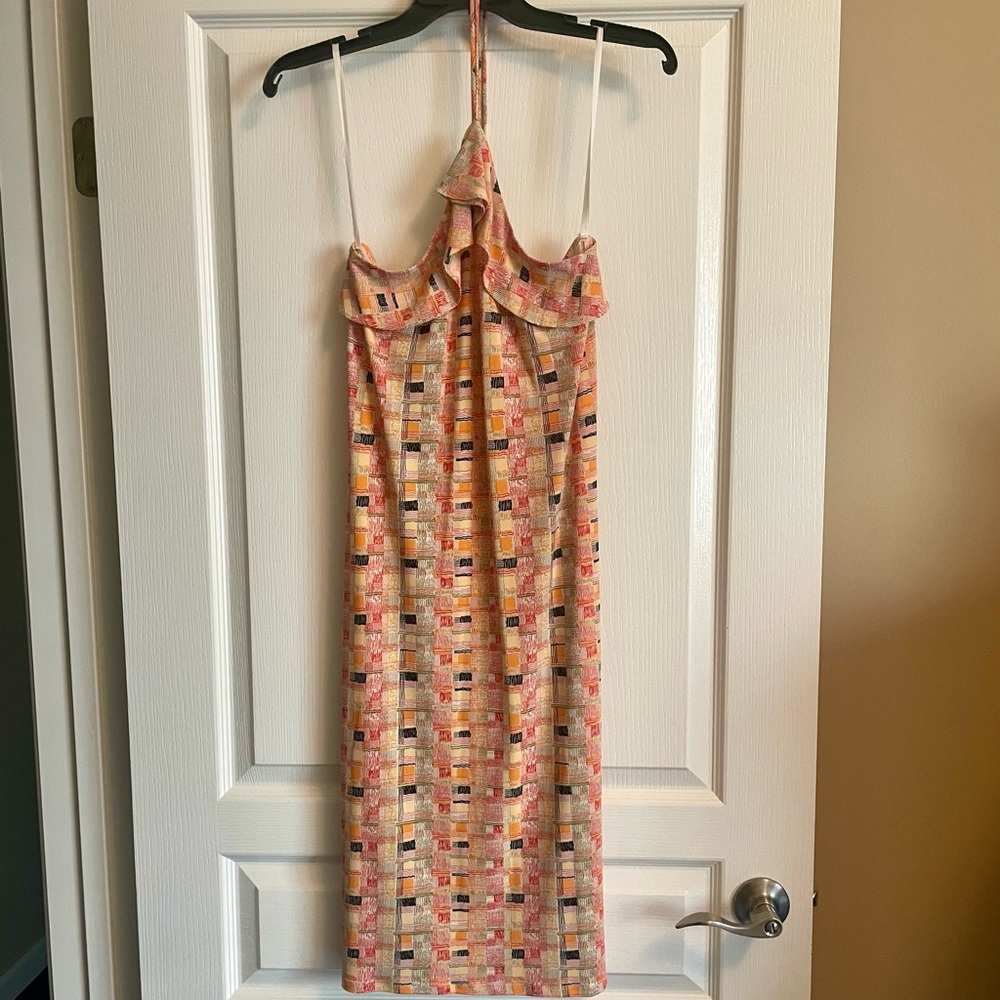 Beautiful colorful geometric strapless midi dress that ties around the neck.